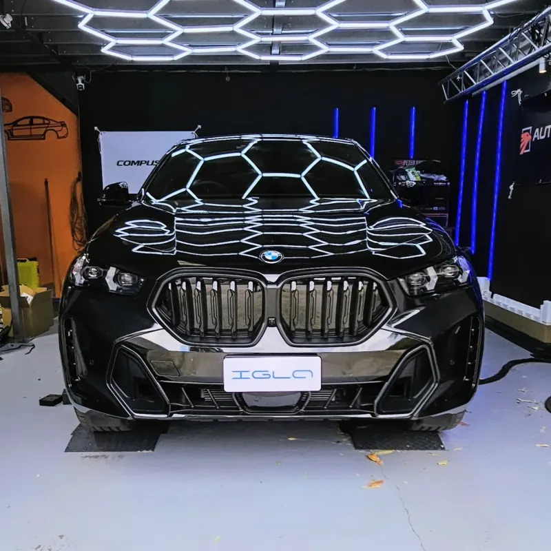 BMW X6 M front-end under the workshop honeycomb lighting at Euro Chiptuning Solutions